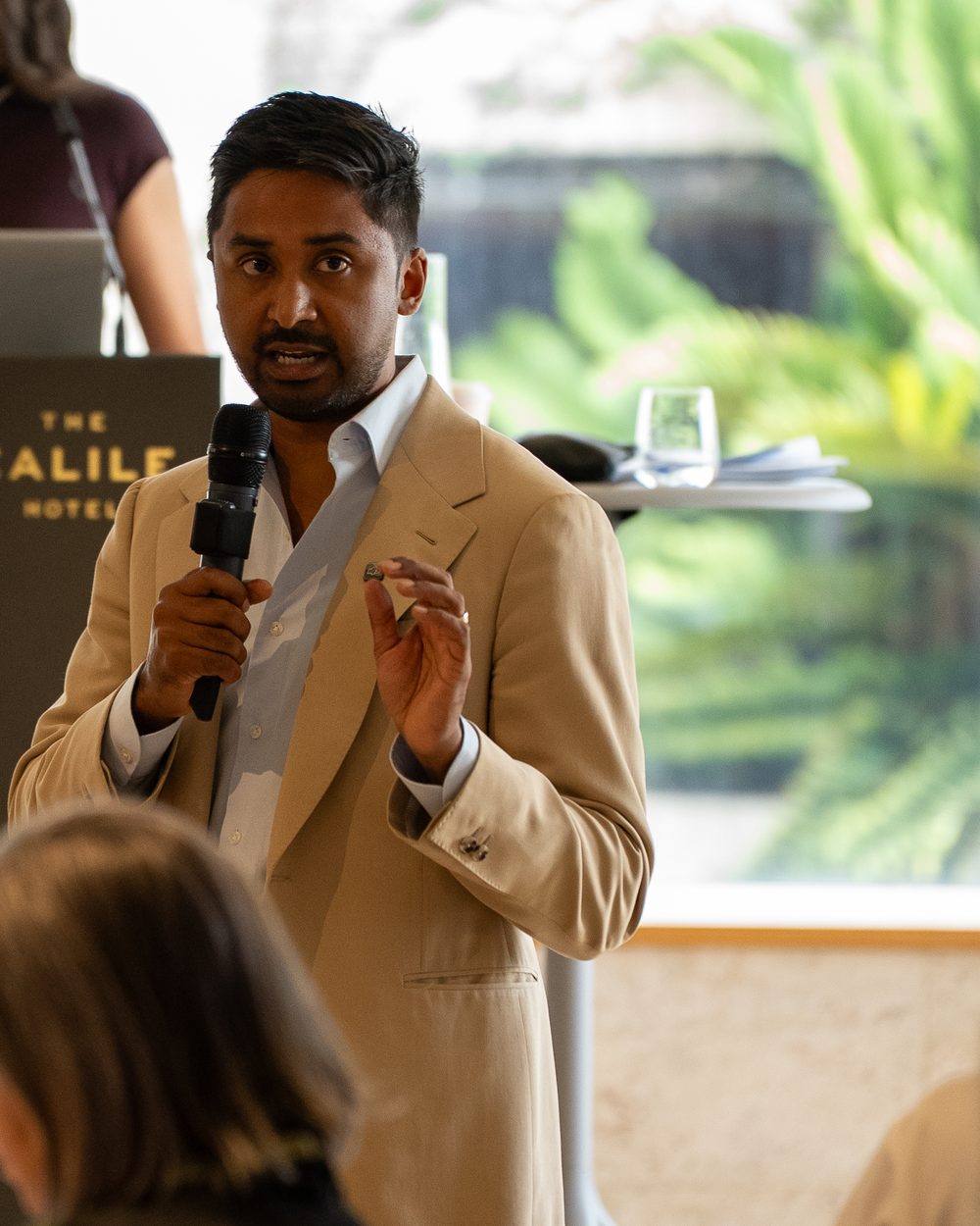 Redom Syed presenting to an audience