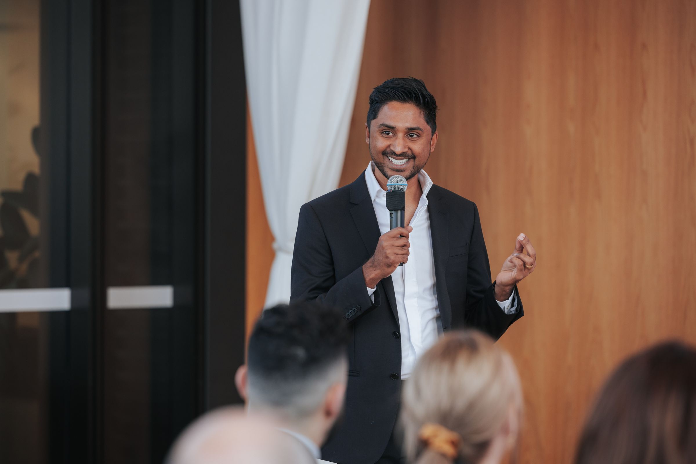 Redom Syed speaking on stage